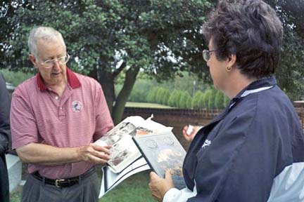 Charles Poland and wife with books