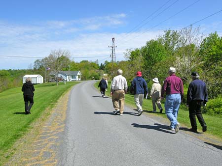 people walking on narrow road